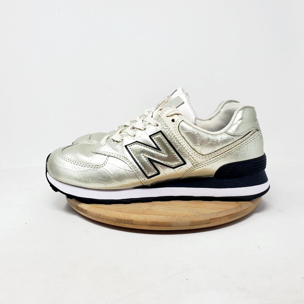 New Balance Women's Sneakers in Metallic Silver and Black